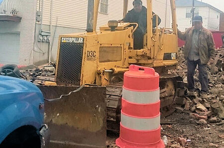 Bulldozer to level the site. 
